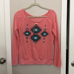 Peach color tribal print sweatshirt.